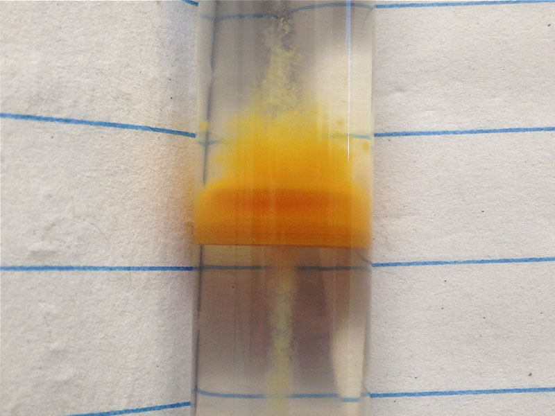 test tube with yellow material