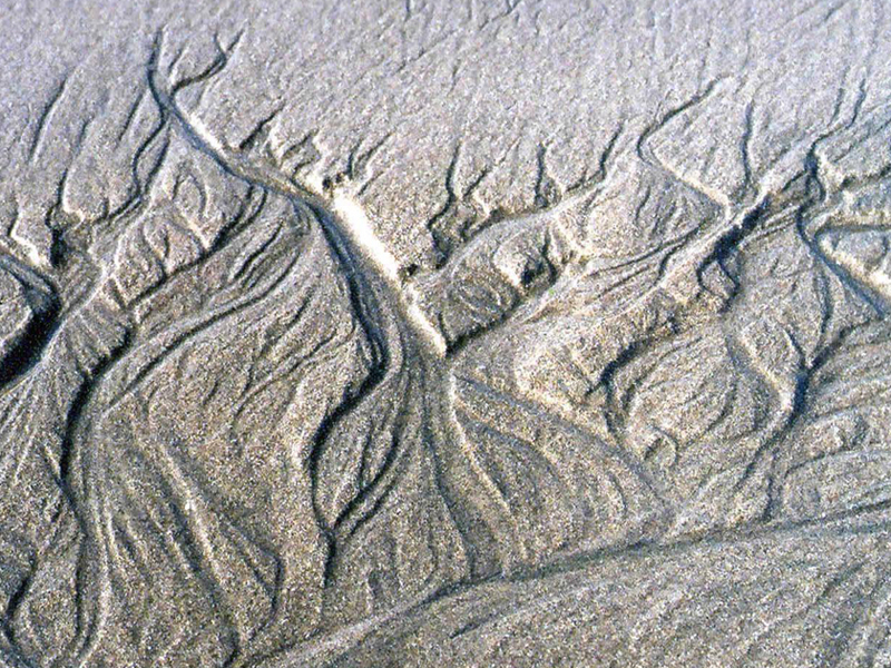 Erosion channels through sand